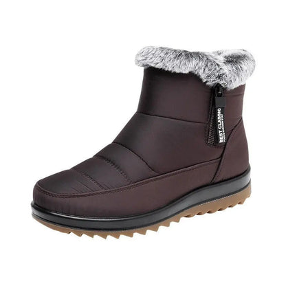 Women's black waterproof mid-calf winter boots with seam-sealed upper for snow and rain