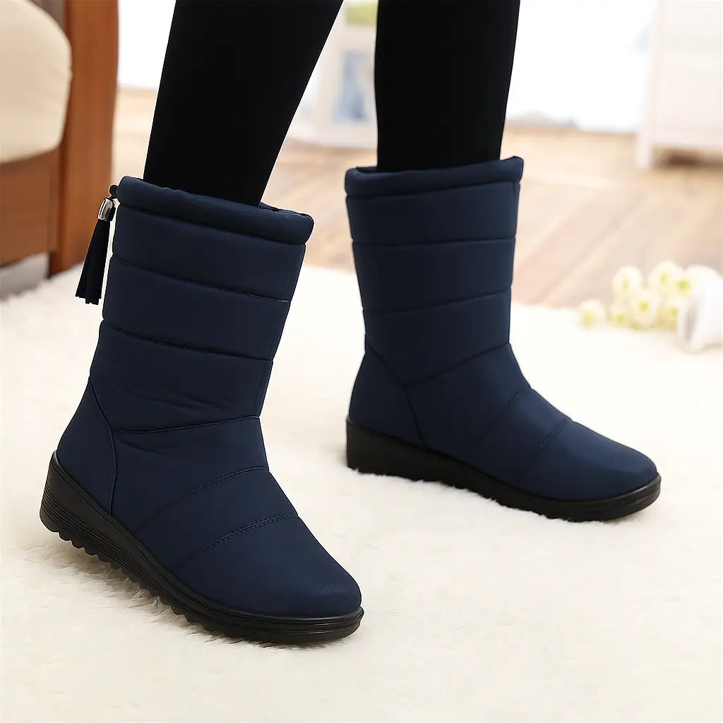 Women's waterproof winter boots with metallic details, warm wool lining, elegant cold-weather style
