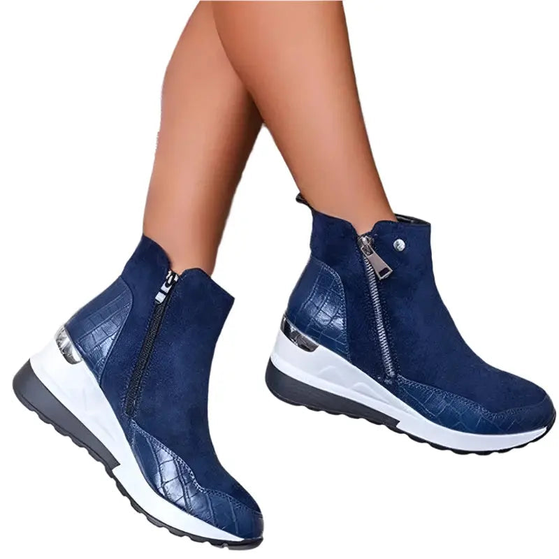 Women's brown wedge heel winter boots with cozy cushioned interior and sleek ankle silhouette