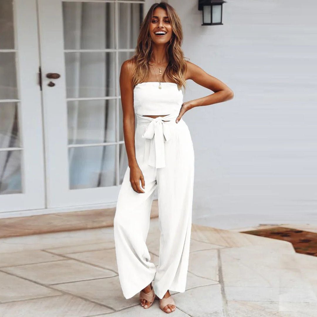 Women's beige strapless wide-leg jumpsuit with self-tie waist bow, resort-ready silhouette