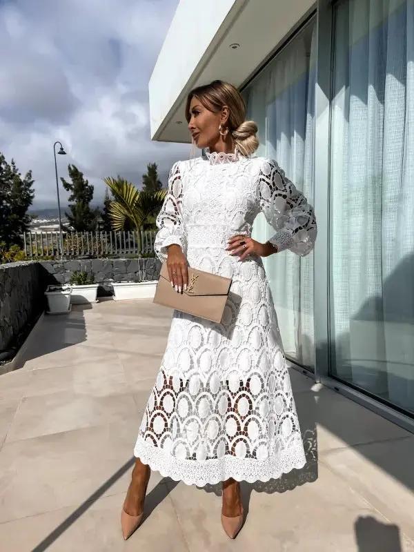 White lace knee-length dress with puff sleeves and high neckline, elegant summer style