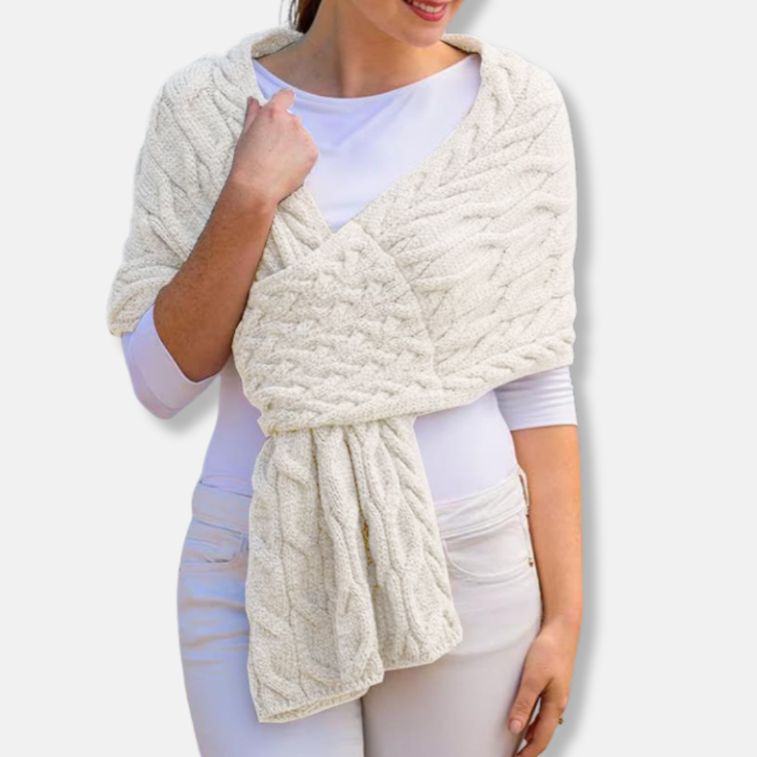 Women's cream wool cable knit shawl scarf with long draped coverage and textured pattern