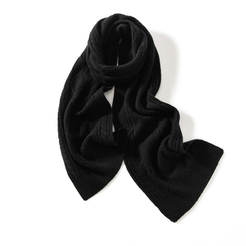 Ivory cable-knit cashmere scarf with sculptural texture and generous drape for luxurious winter style
