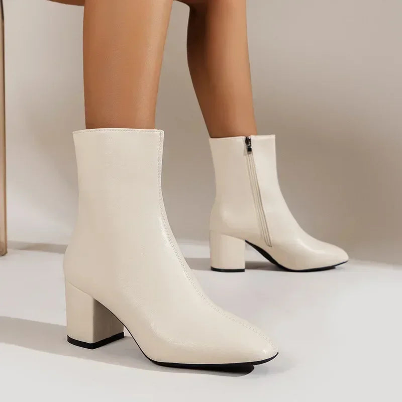 Women's black block heel ankle boots with side zipper closure, polished everyday style