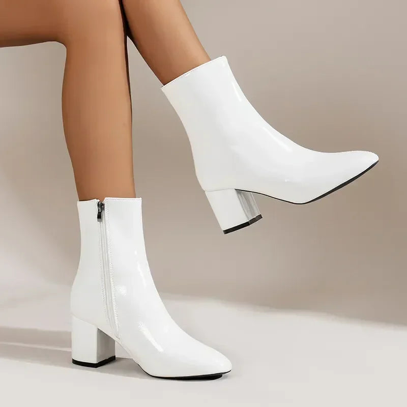 Women's black block heel ankle boots with side zipper closure and polished everyday silhouette