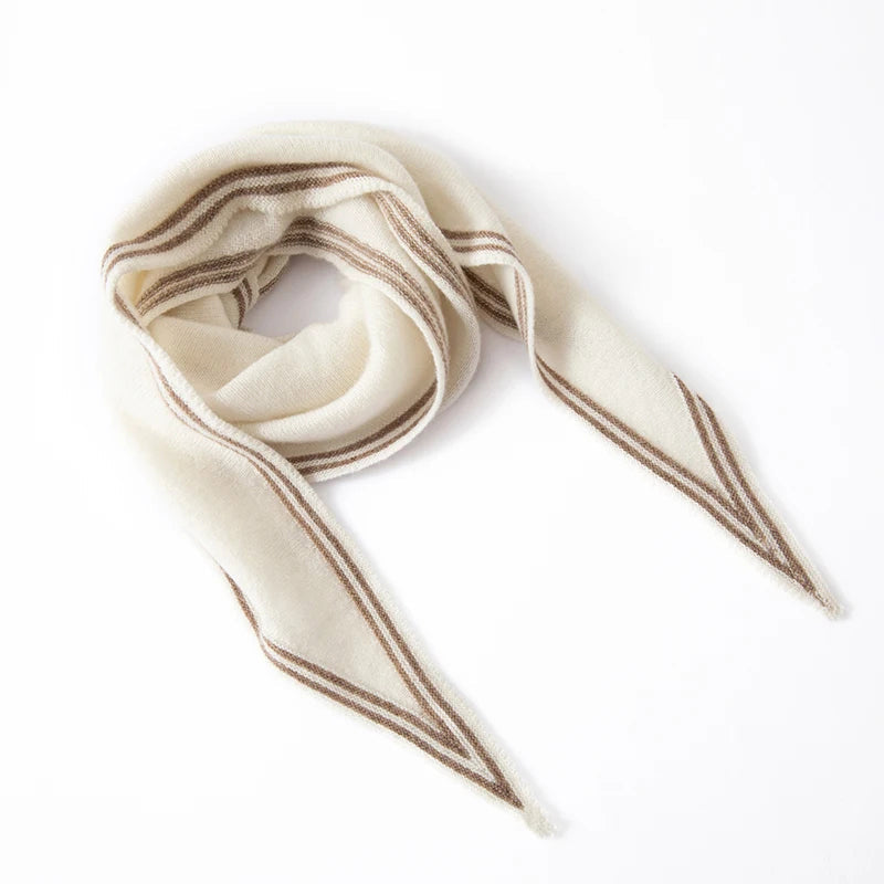 Women's slim cashmere knit scarf in neutral tones with contrast stripe trim, elegant winter wrap