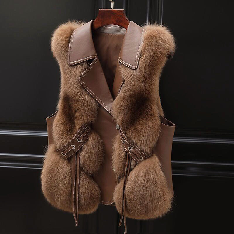 Women's white faux fur vest with wide lapel collar and adjustable waist tie, hip-length