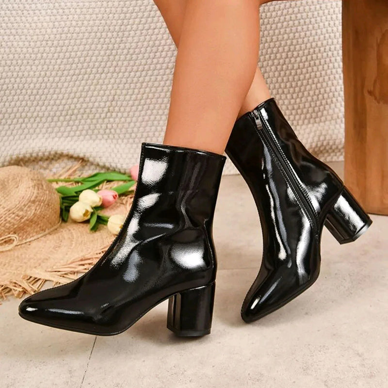 Women's glossy black ankle boots with block heel, side zipper closure, and sleek PU leather finish