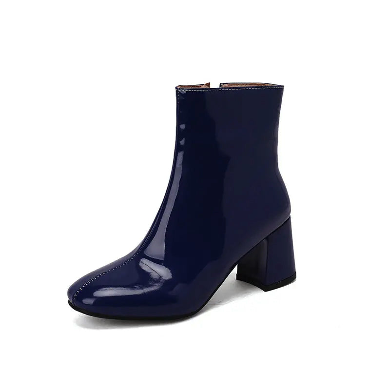 Women's black glossy PU leather ankle boots with chunky block heel and sleek contemporary silhouette