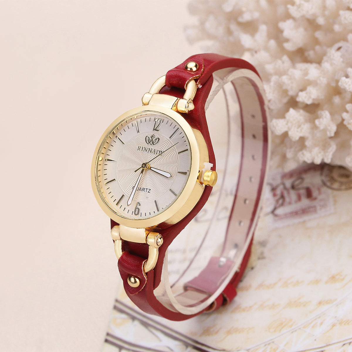 Women's quartz wristwatch gold-tone bezel minimalist dial slim faux leather strap elegant