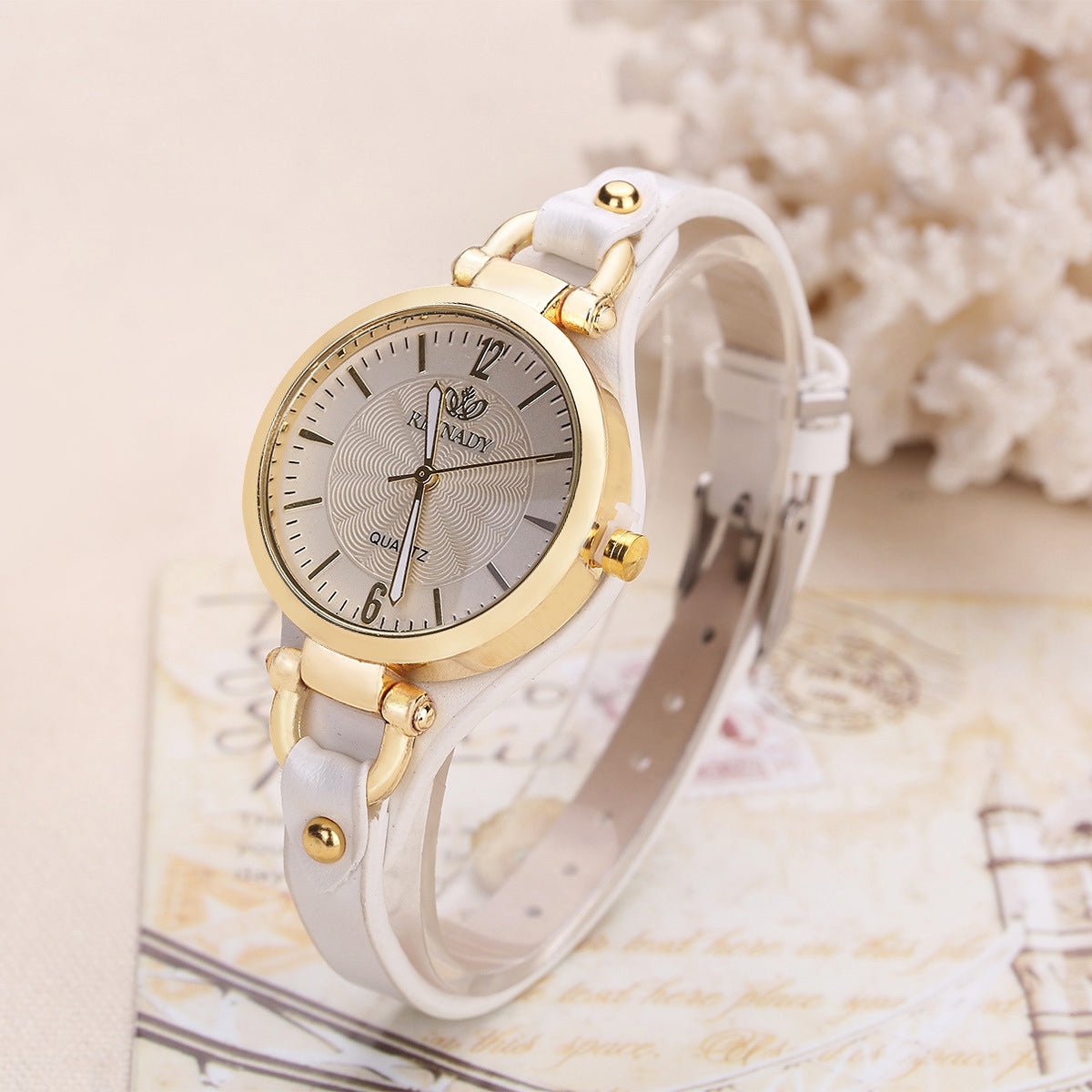 Women's quartz wristwatch gold-tone bezel minimalist dial slim faux leather strap elegant