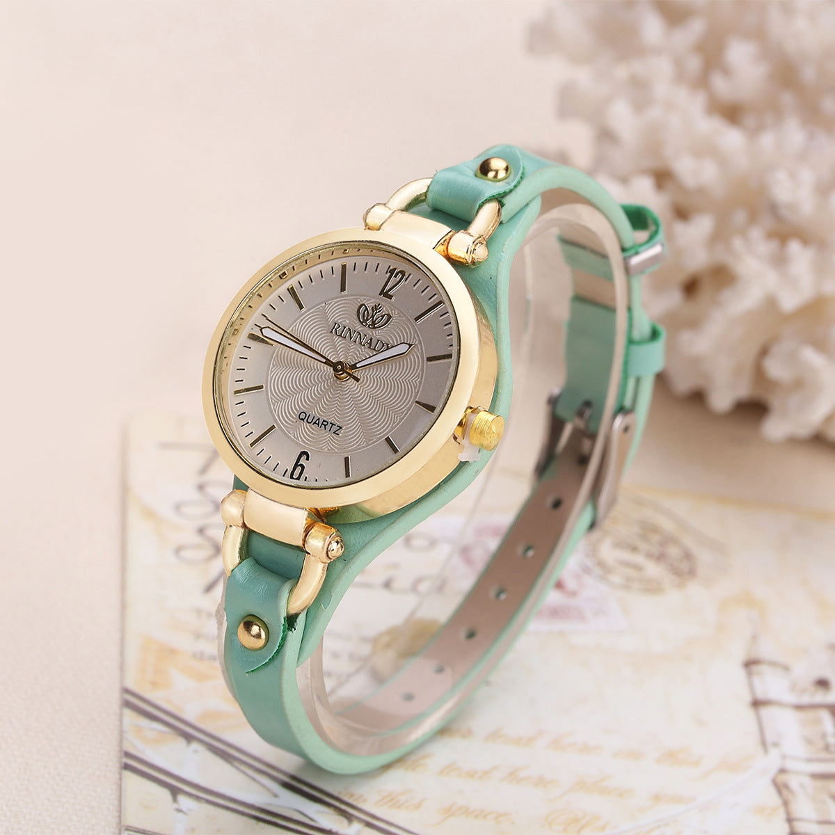 Women's quartz wristwatch gold-tone bezel minimalist dial slim faux leather strap elegant
