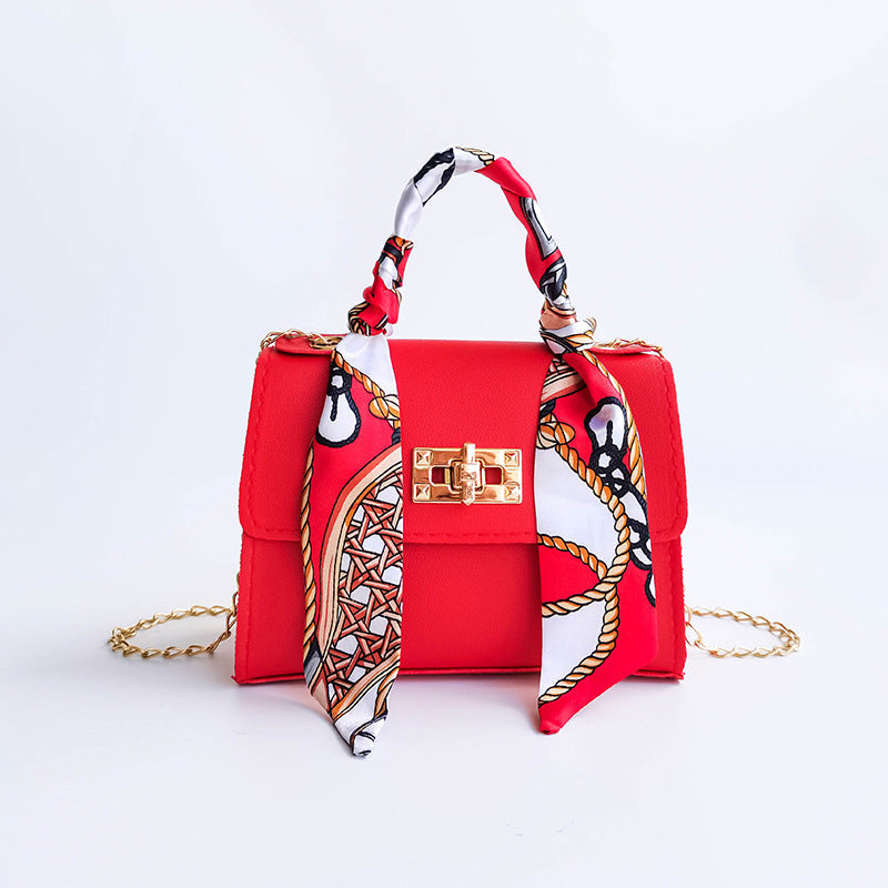 Wavlynn small structured flap bag with gold twist-lock clasp and silk scarf-wrapped top handle