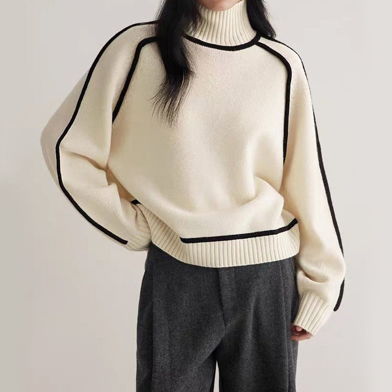 Women's relaxed-fit turtleneck knit sweater with bold contrast trim and dropped shoulders for chic layering