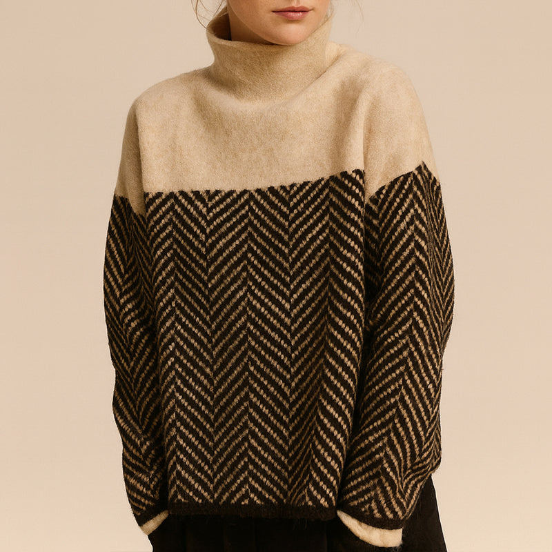 Women's hip-length chevron pattern turtleneck sweater with dropped shoulders relaxed silhouette