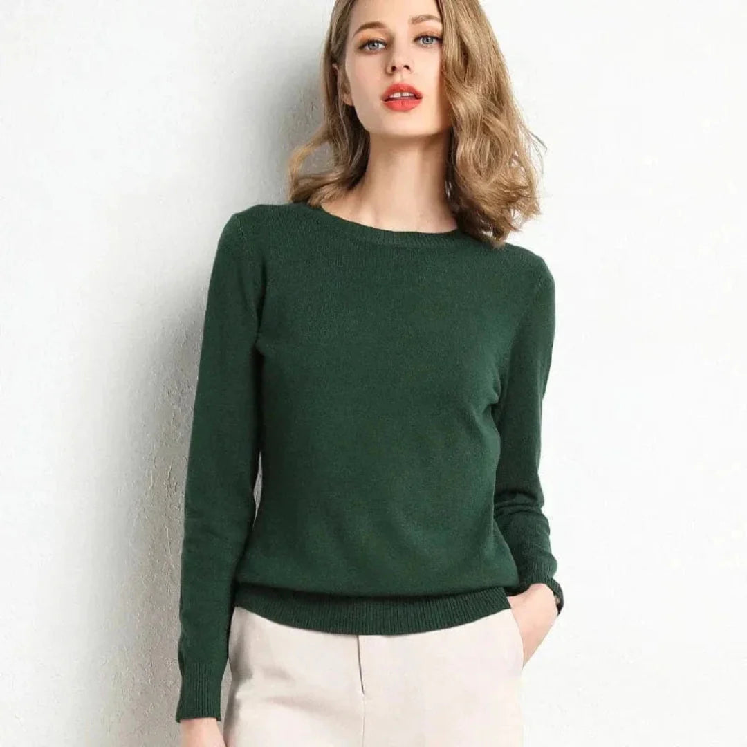 Women's cream cashmere crew neck sweater with ribbed cuffs and hem, flattering soft fit