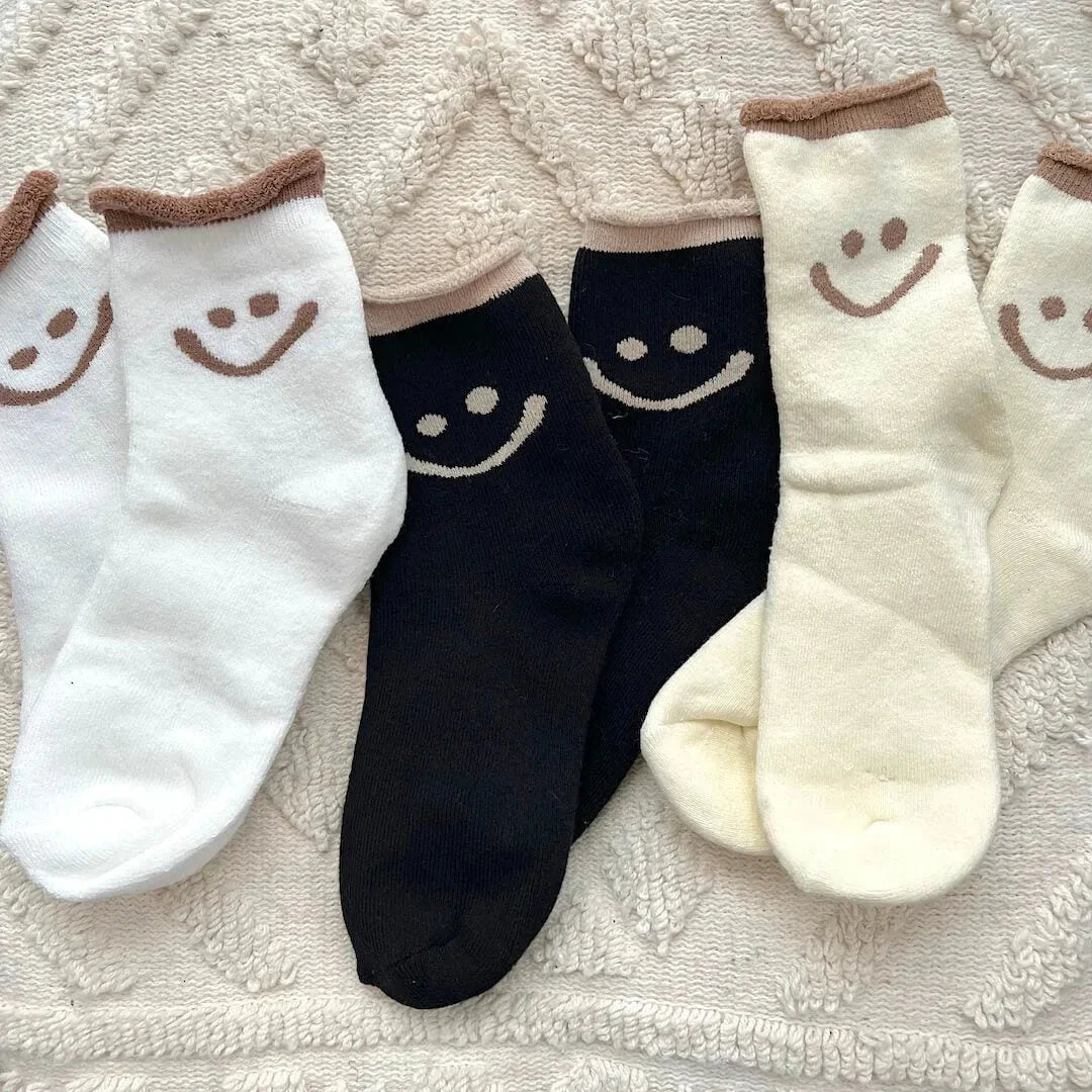 Women's white ankle socks with embroidered smiley face, plush cotton blend, playful happy face design