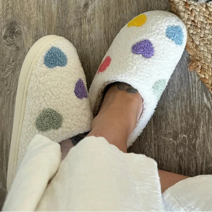 Women's white sherpa plush slippers with colorful embroidered pastel hearts and non-slip sole