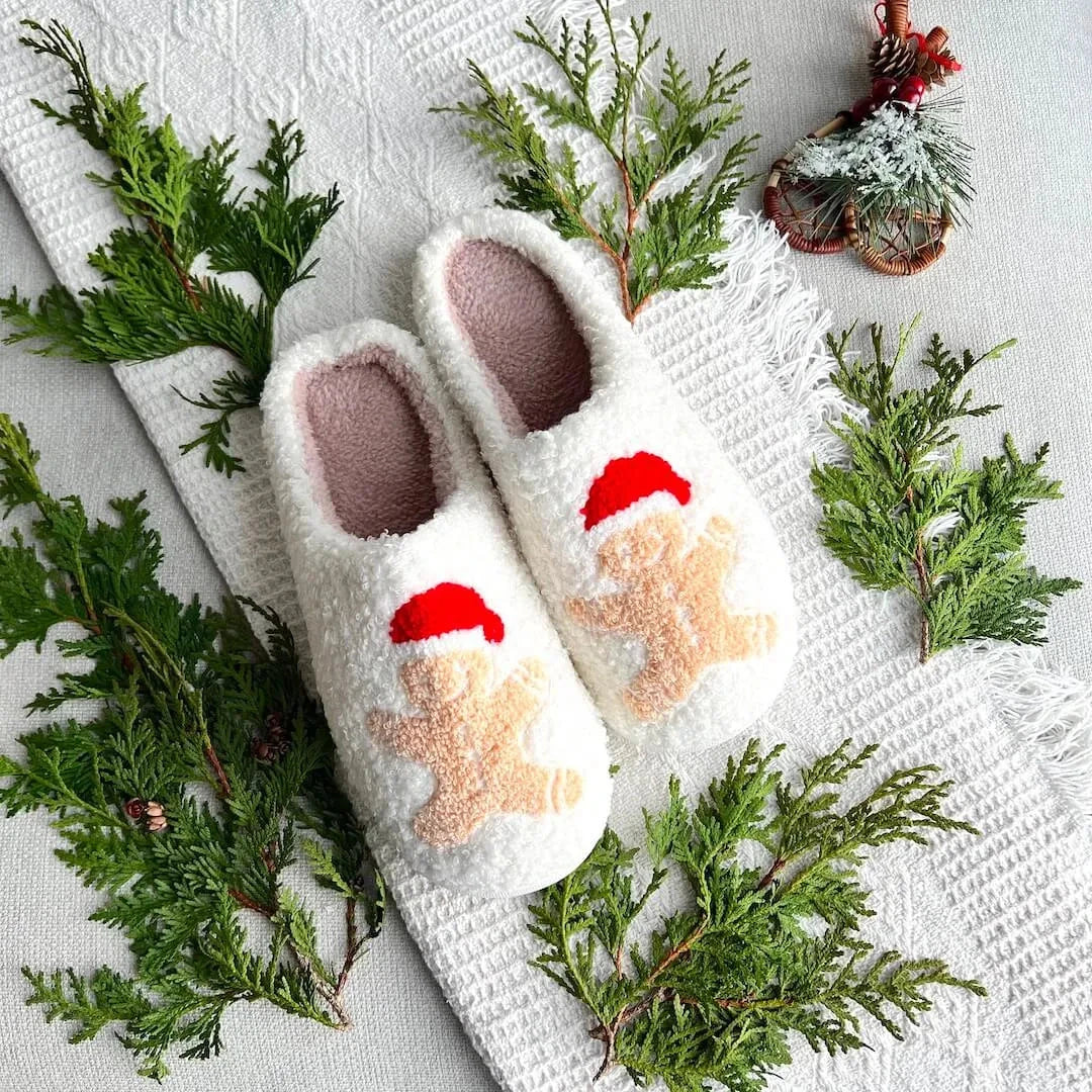 Women's Christmas plush slippers with soft fleece lining, festive embroidered characters, and non-slip sole