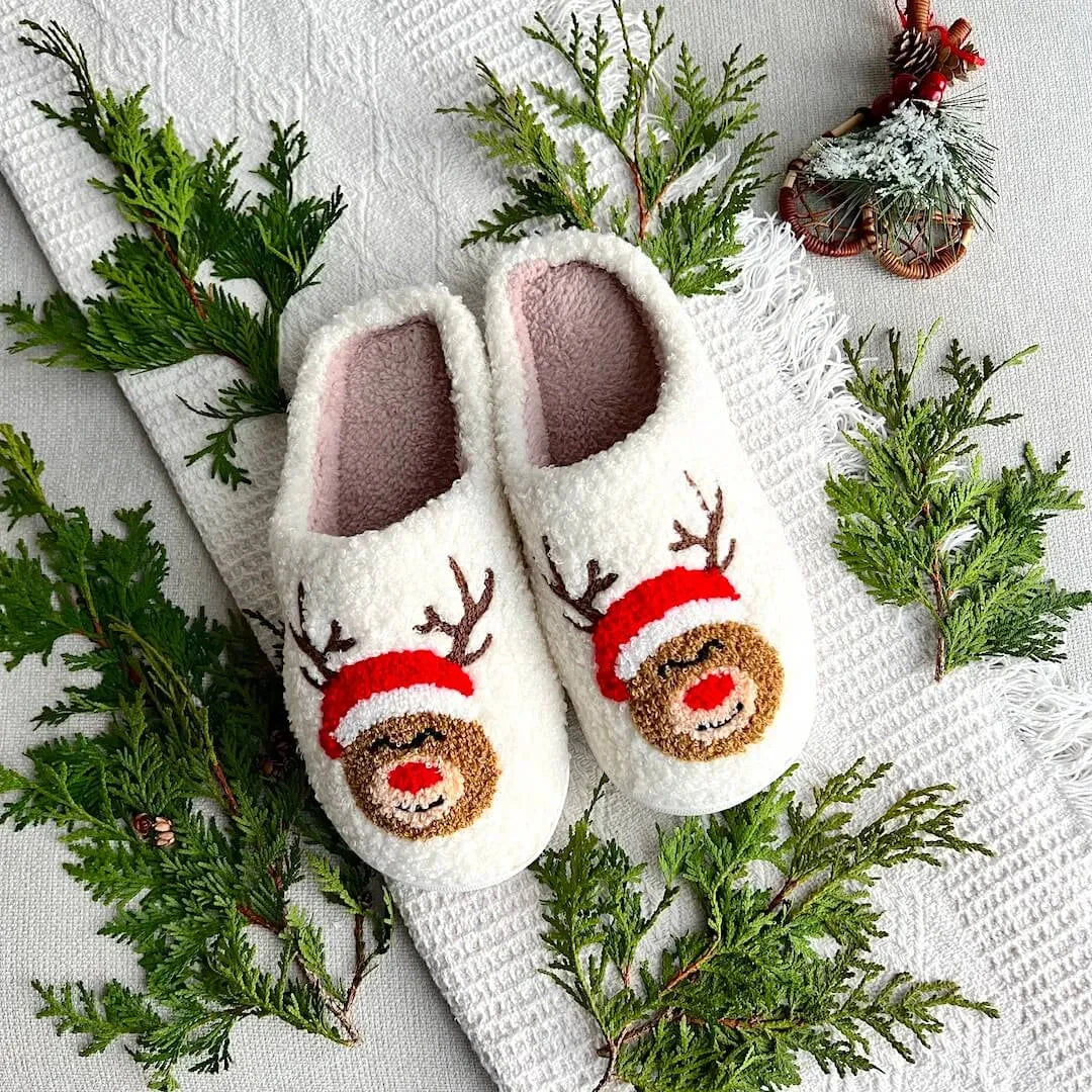 Women's Christmas plush slippers with fluffy fleece lining, festive embroidered characters, and non-slip sole