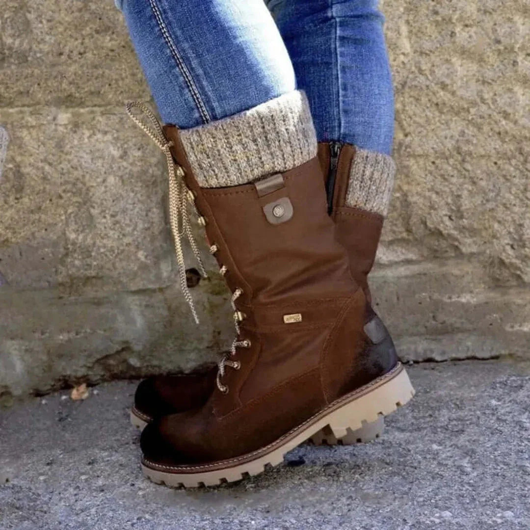 Women's black lace-up winter boots with waterproof upper and thick thermal lining for cold weather