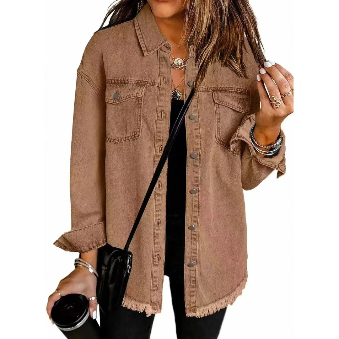 Women's oversized denim shirt jacket in blue with frayed hem, relaxed fit for casual layering