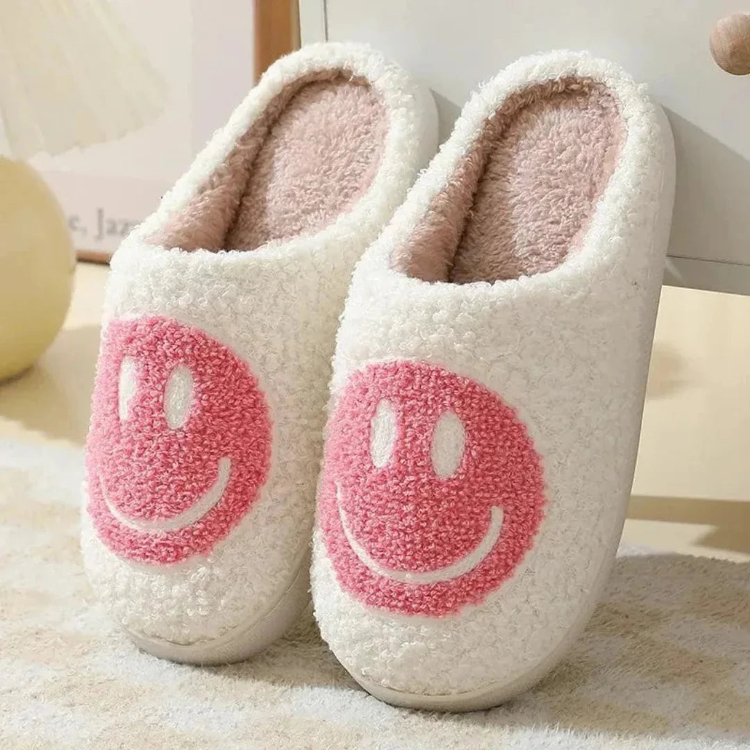 Women's yellow plush sherpa slippers with embroidered smiley face design and cushioned anti-slip sole