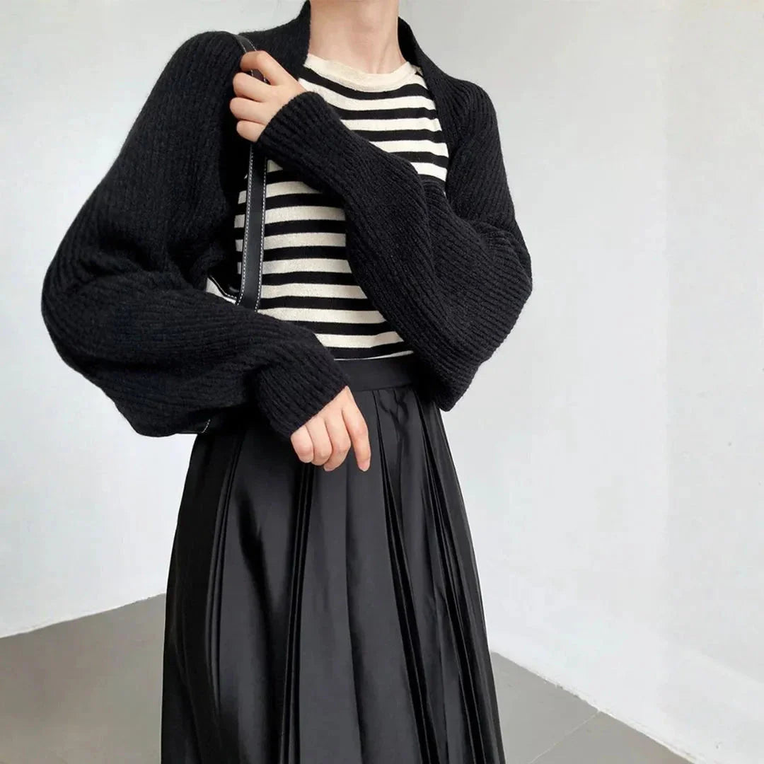 Women's soft ribbed shrug cardigan in neutral tone, open-front drape with relaxed long sleeves