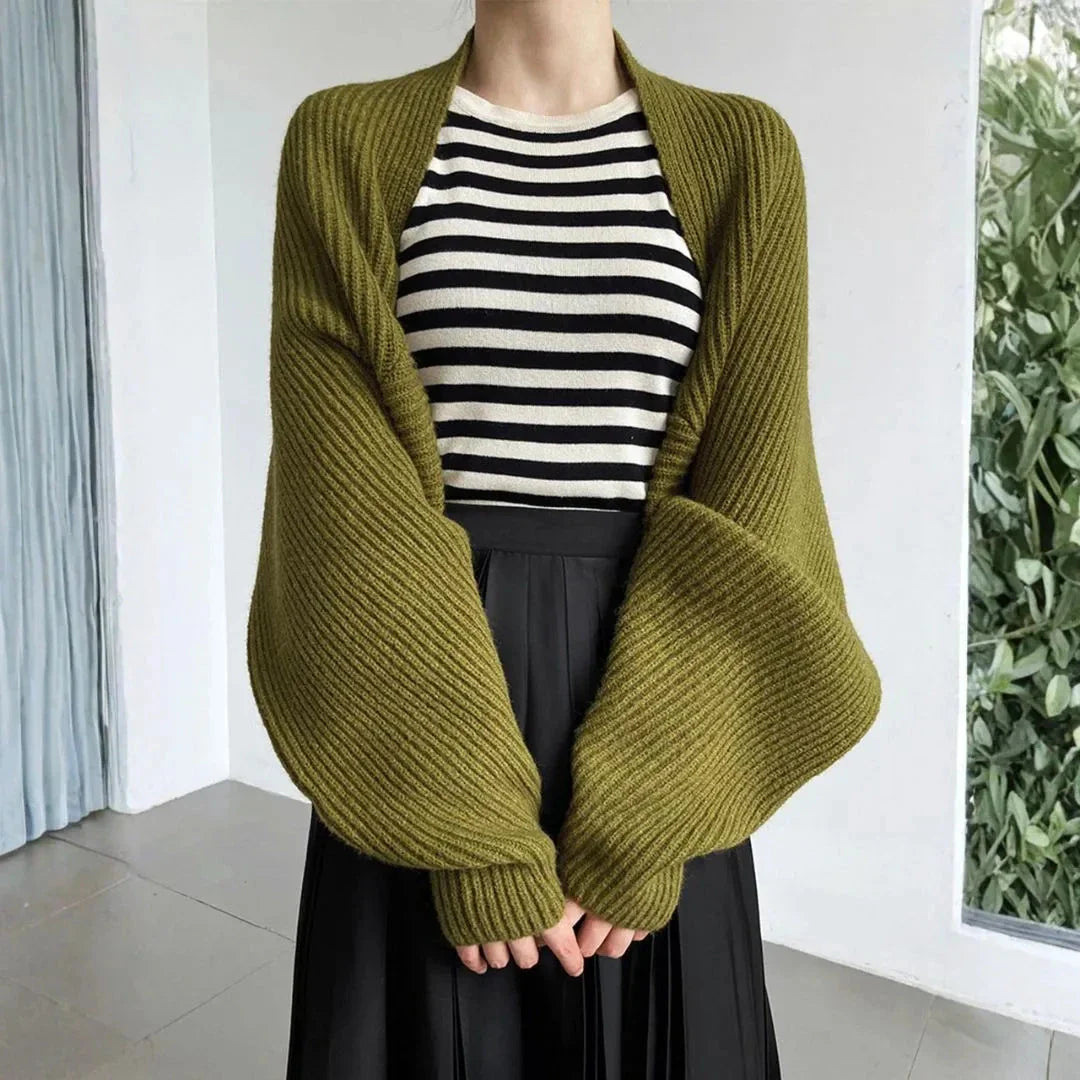 Women's soft ribbed shrug cardigan in neutral tone, open-front drape, relaxed long sleeves lightweight layer