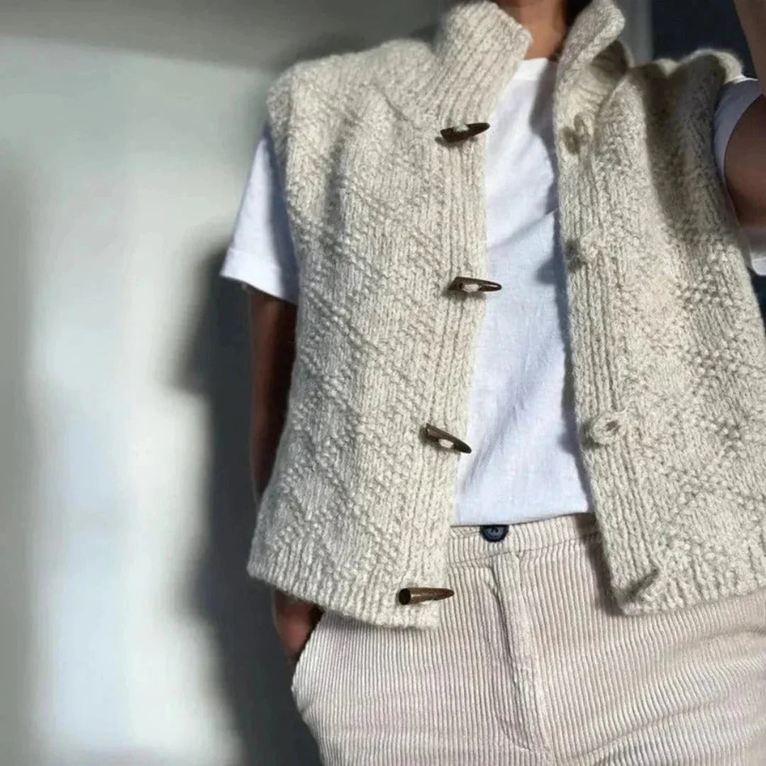 Women's toggle button wool vest in neutral tones, textured hand-knit sleeveless layering piece