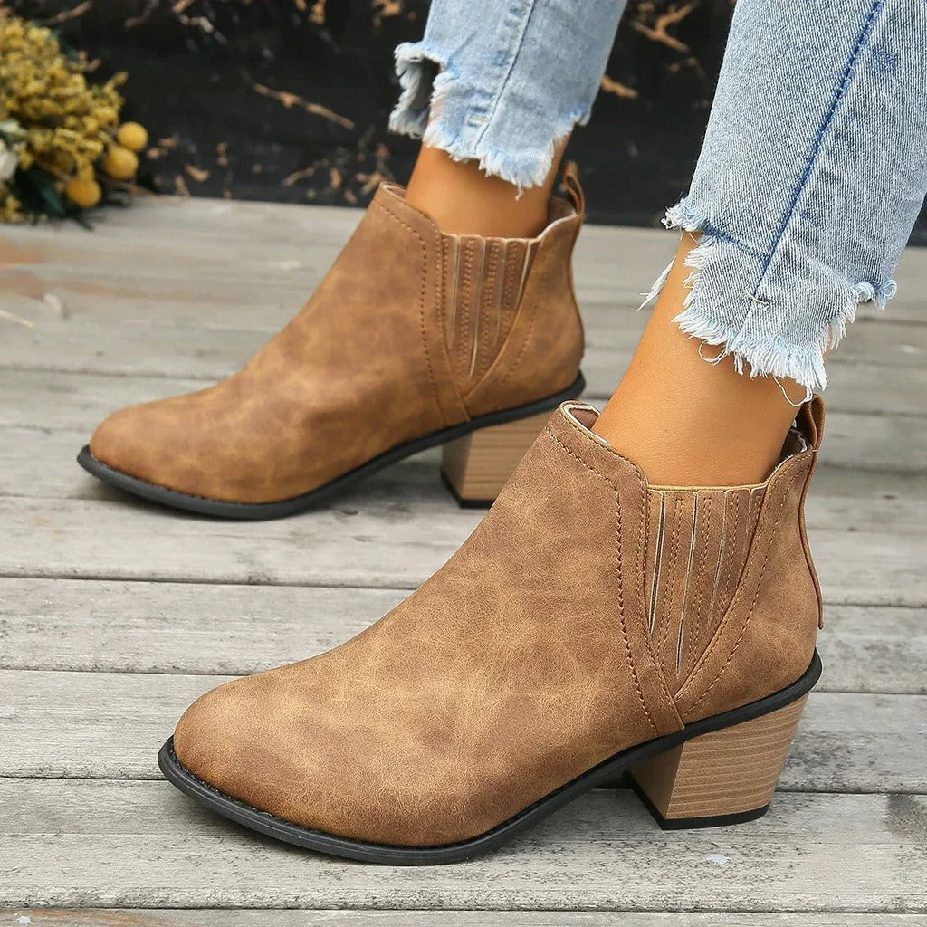 Women's low-calf boots in neutral tone, sleek everyday silhouette with side zip closure for easy wear