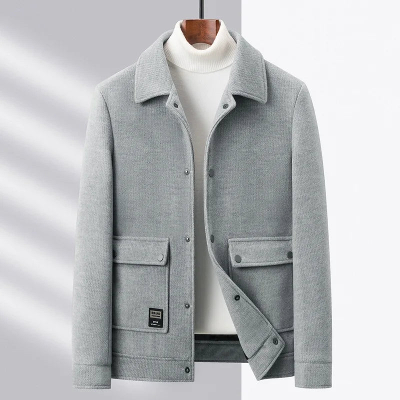 Charcoal wool-blend unisex jacket with snap-button front, textured finish, and smart-casual structured silhouette