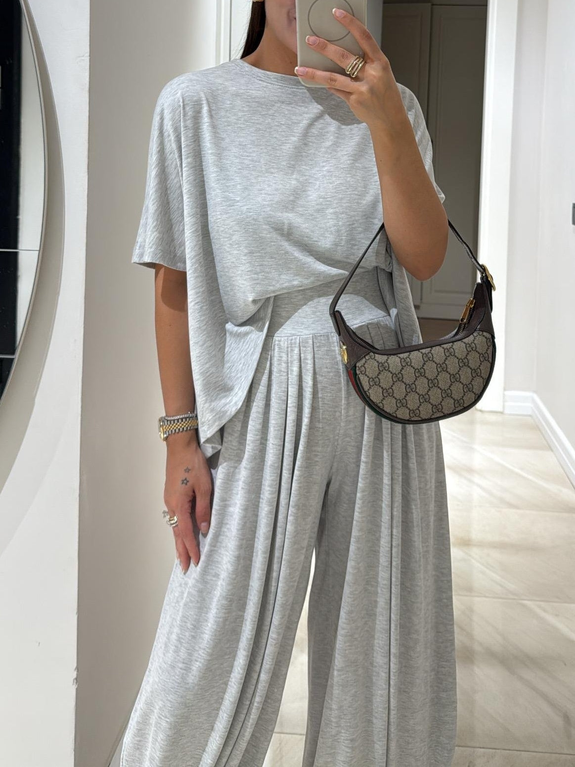Beige casual two-piece set with relaxed top and flowing wide-leg pants, lightweight breathable fabric