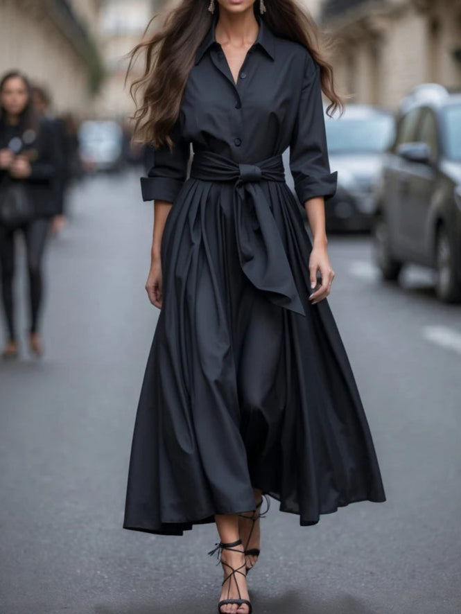Elegant black long-sleeve tie waist maxi dress with shirt-style design and flowing silhouette