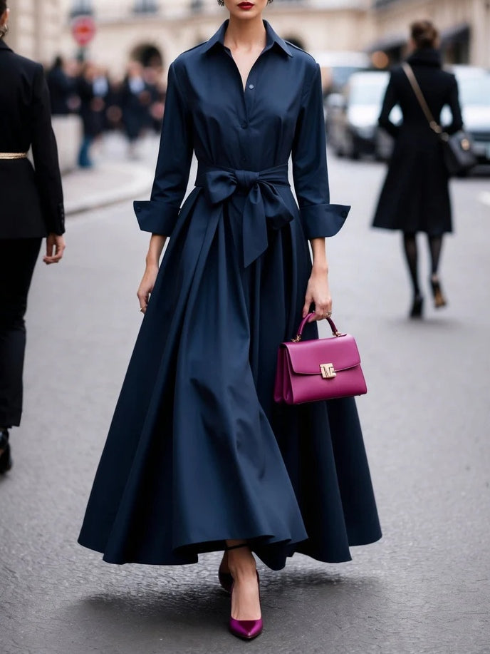 Elegant black long-sleeve tie-waist maxi dress with flowing silhouette and chic shirt-style design