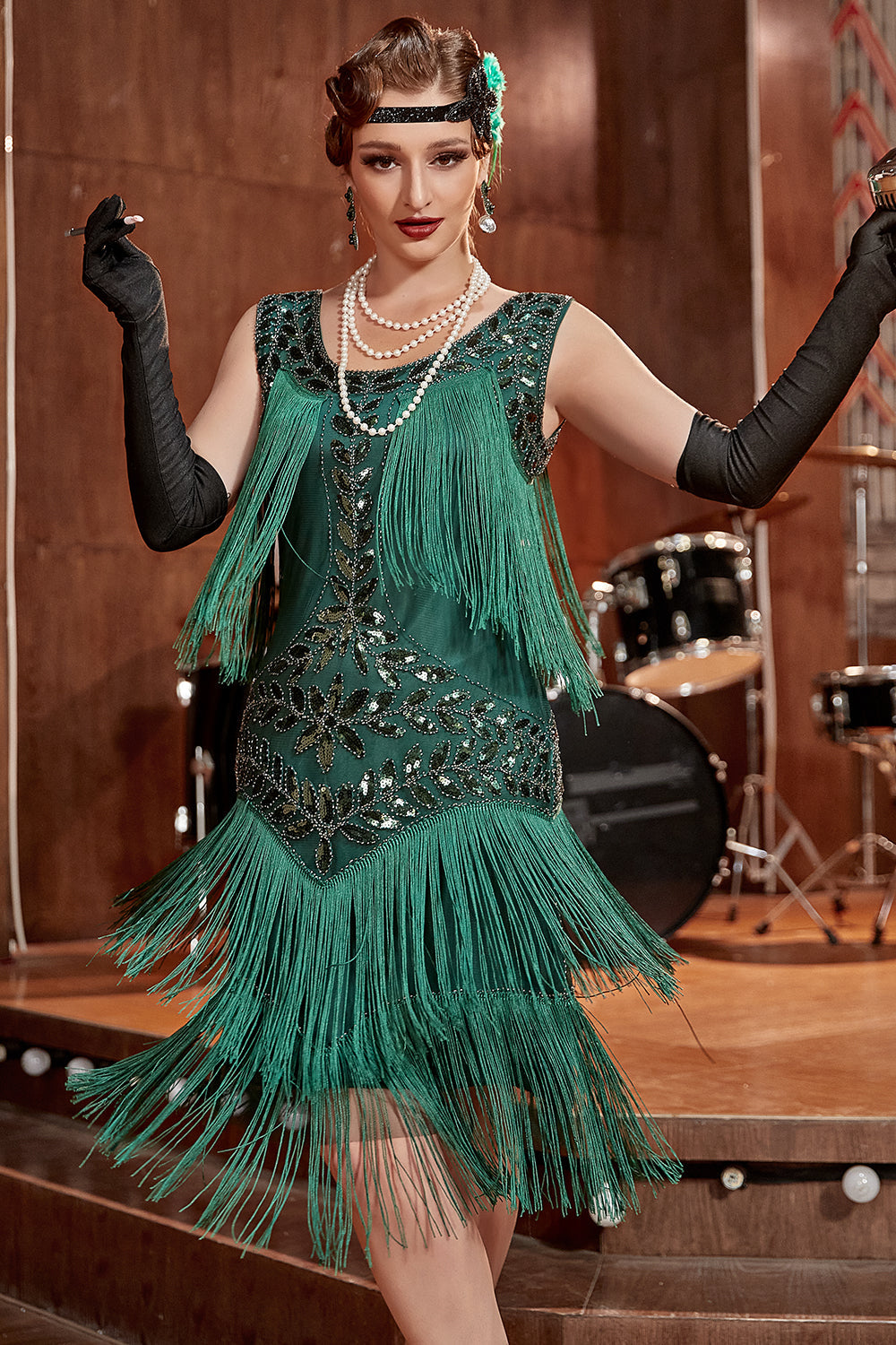 Women's black sleeveless flapper dress with pearl sequins, cascading fringe, vintage 1920s Jazz Age style