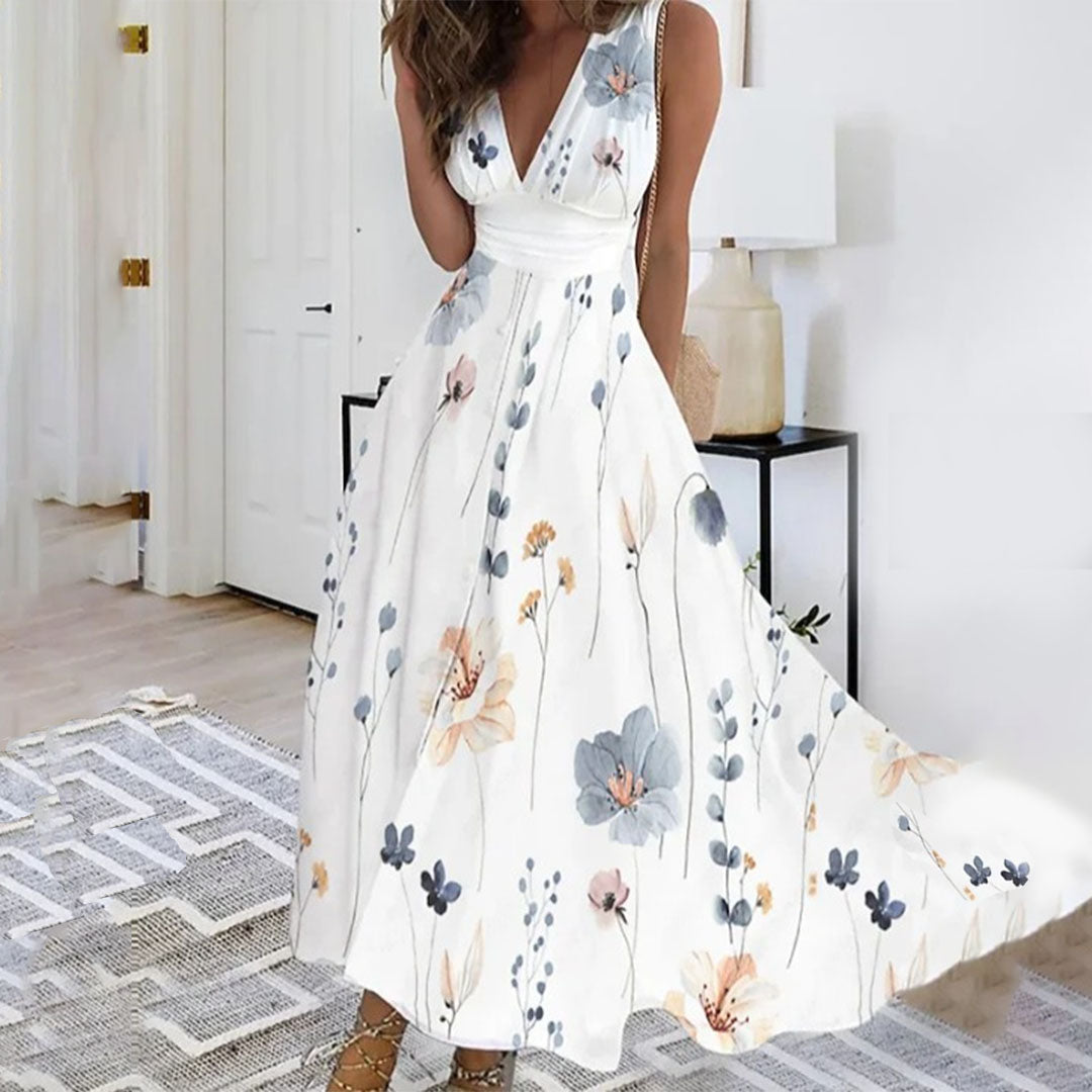Women's sleeveless V-neck maxi dress in vibrant blue floral print with flowing full-length silhouette