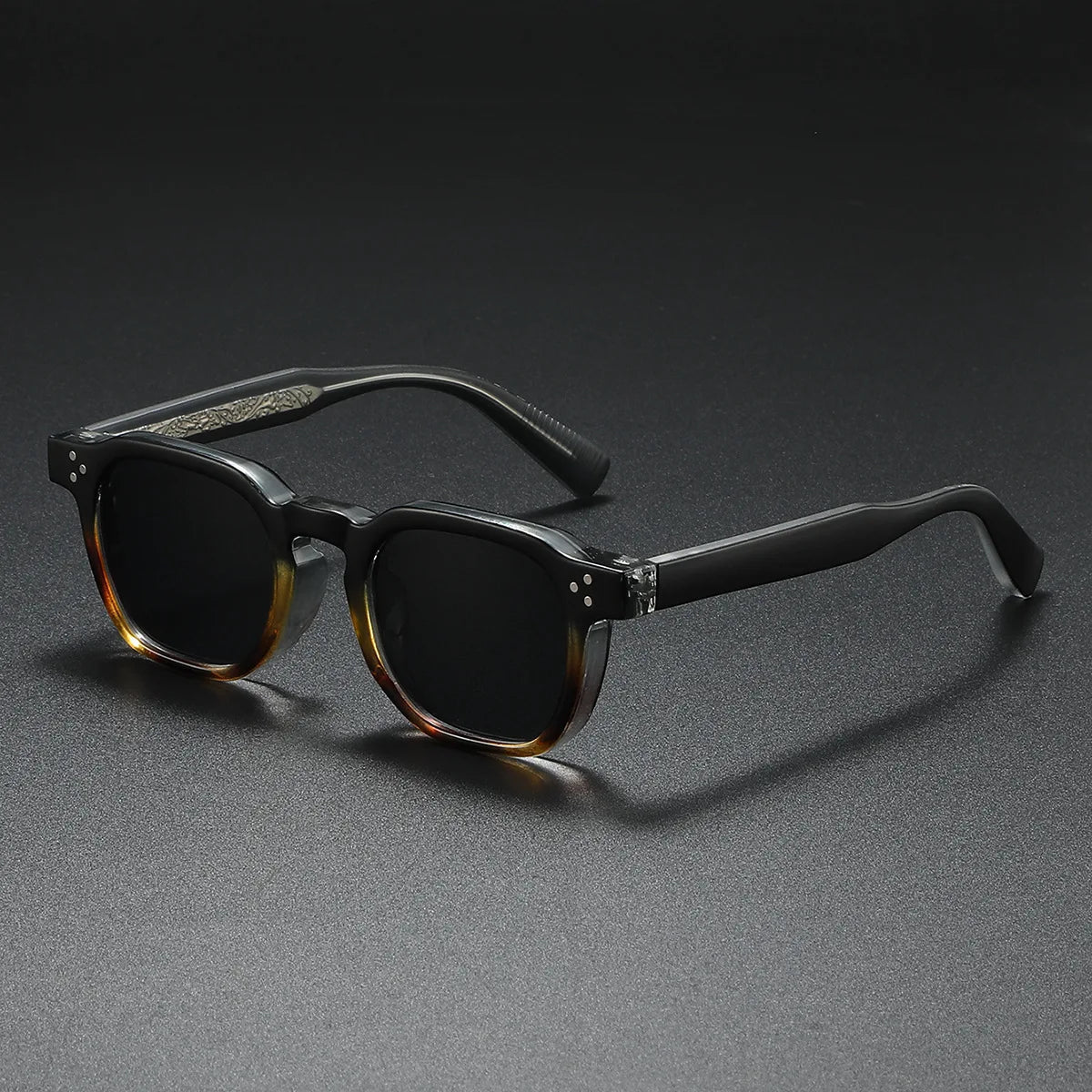 Bold black acetate block-frame sunglasses with thick retro silhouette and UV400 protection