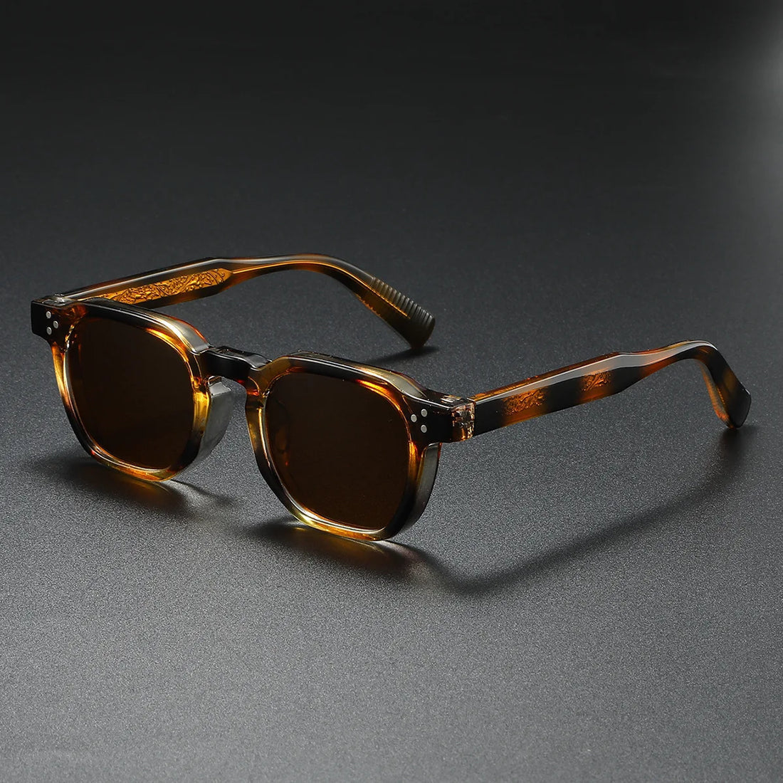 Bold black acetate block-frame sunglasses with thick retro silhouette and UV400 protection