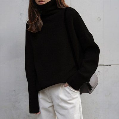 Oversized turtleneck knit sweater in soft neutral tone, relaxed unisex silhouette with draped fluid fit