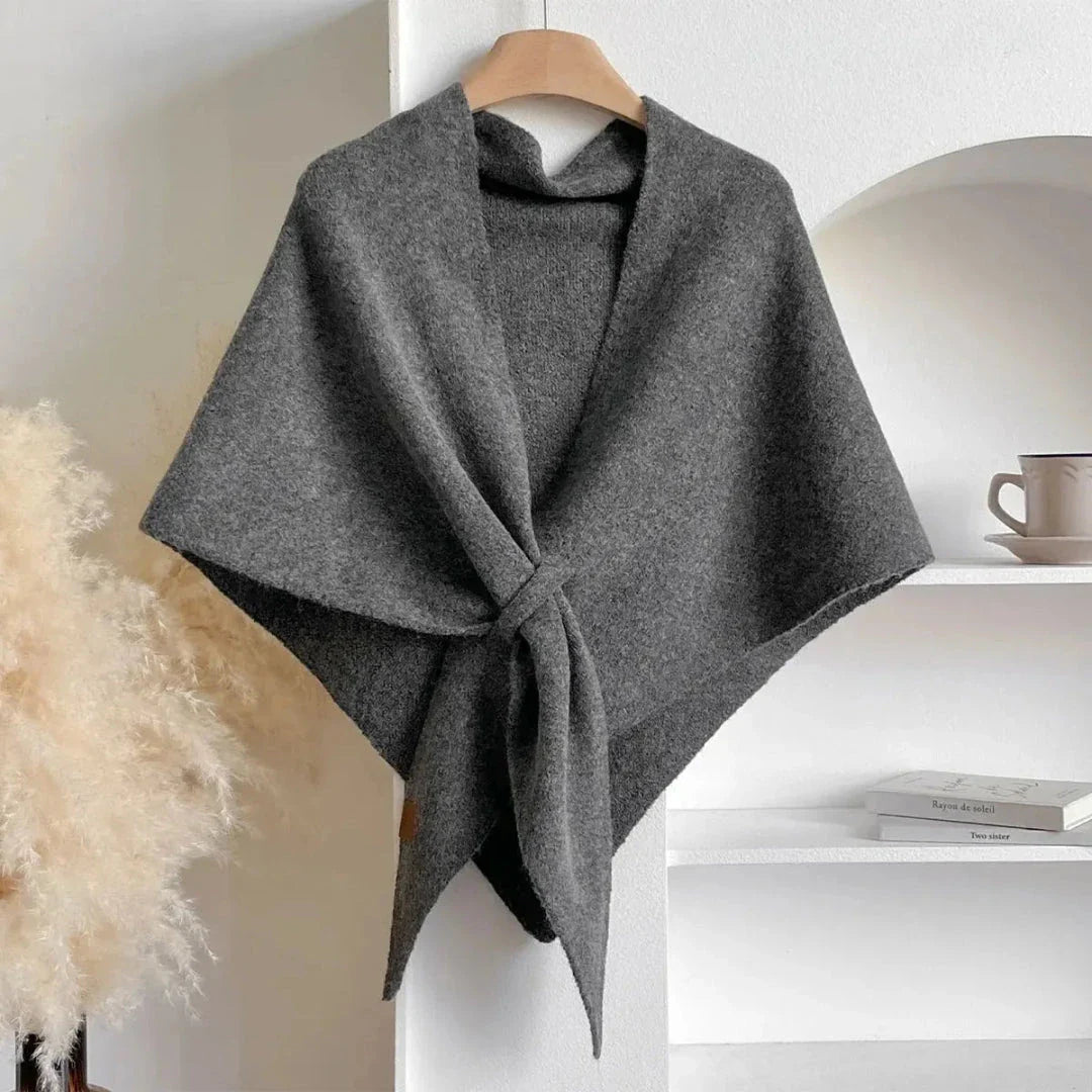 Soft knit shawl in neutral tones with tie-front design and elegant drape for effortless layering