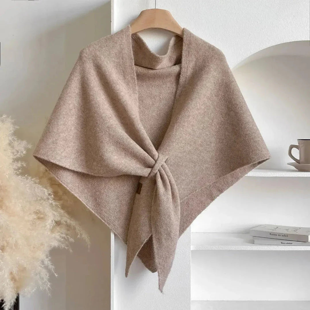 Soft knit shawl in neutral tone with tie-front design and elegant draped silhouette