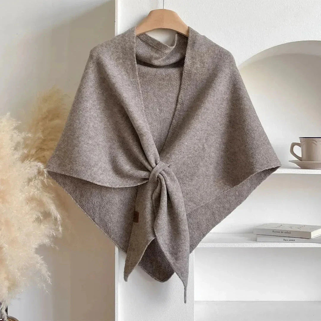 Soft knit shawl in neutral tones with tie-front design and elegant draped silhouette