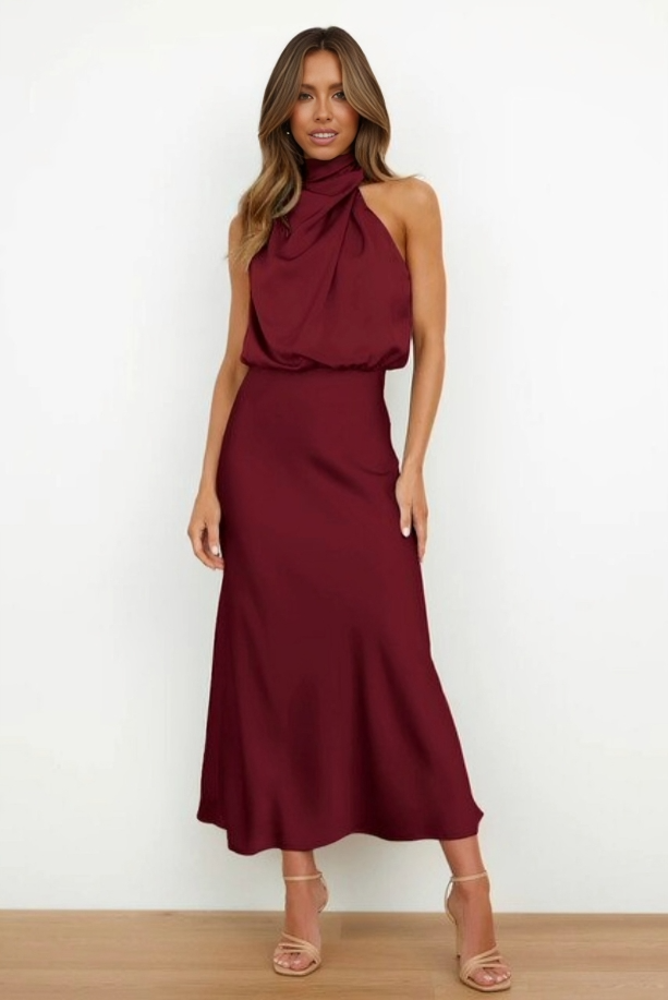 Elegant black satin halter evening dress with flowing silhouette and sleek finish