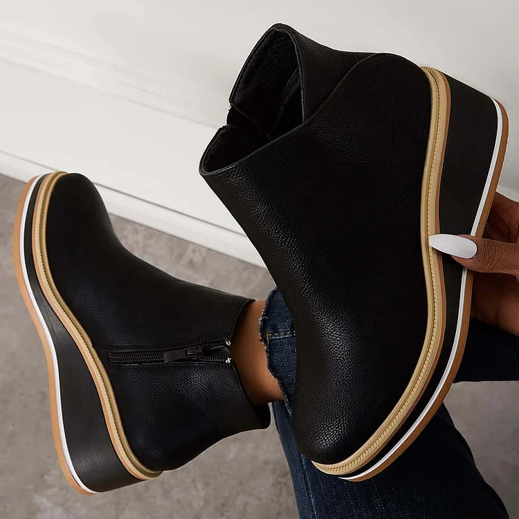 Women's black modern luxury ankle boots with cushioned ergonomic support and sleek contemporary silhouette