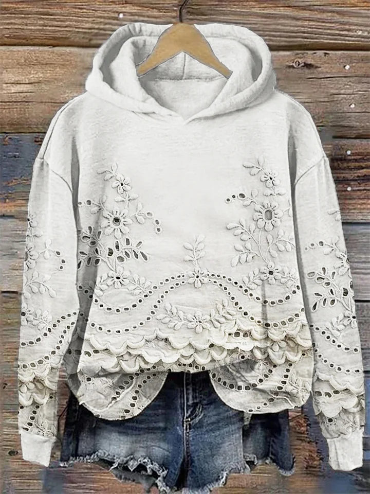 Relaxed-fit floral embroidered hoodie in soft tones with delicate feminine stitching detail