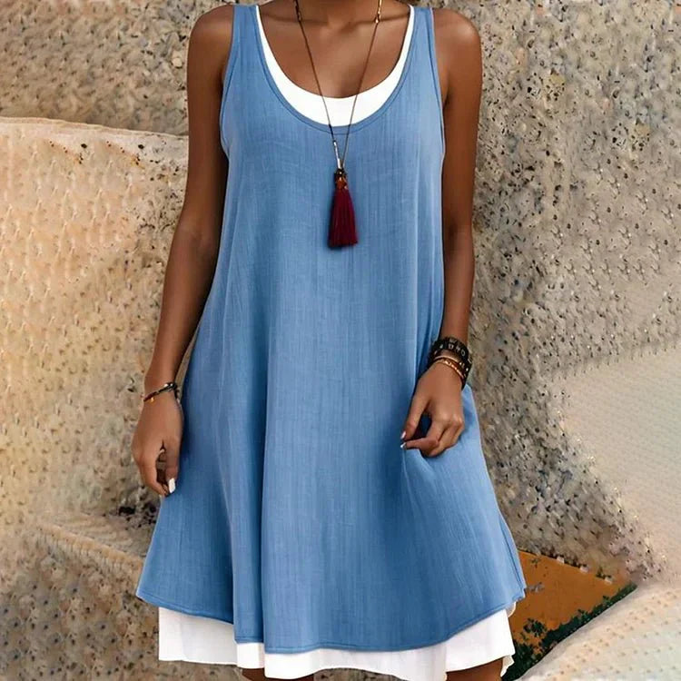 Women's sleeveless scoop neck layered mini dress in dark and white faux two-piece design