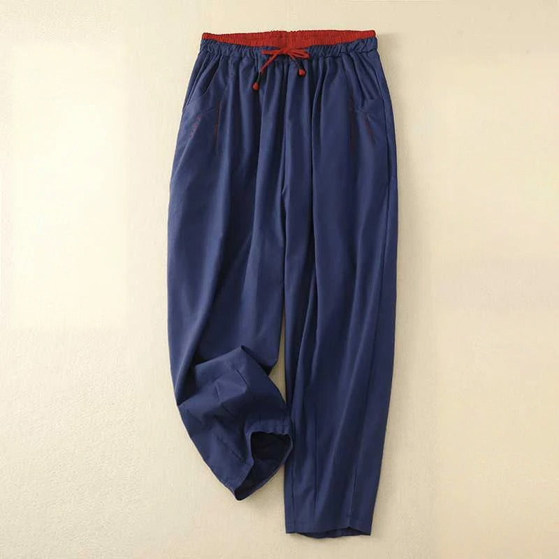Beige relaxed-fit summer pants with contrast waistband, lightweight fabric for effortless warm-weather style