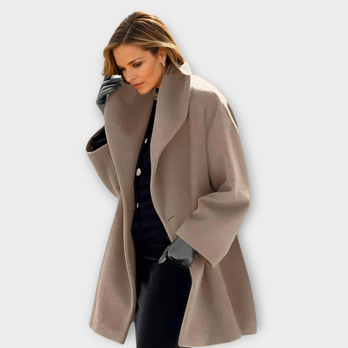Women's oversized thigh-length wool coat in neutral tone, relaxed silhouette with structured drape