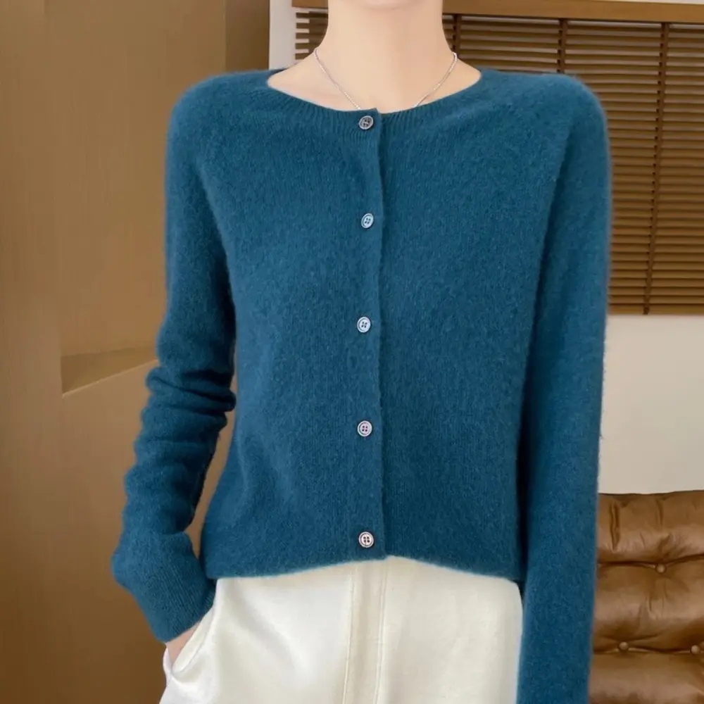 Warm orange merino wool cardigan with refined silhouette and soft breathable knit